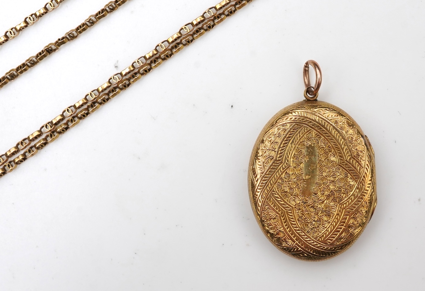 A Victorian gold locket and chain, late 19th century
